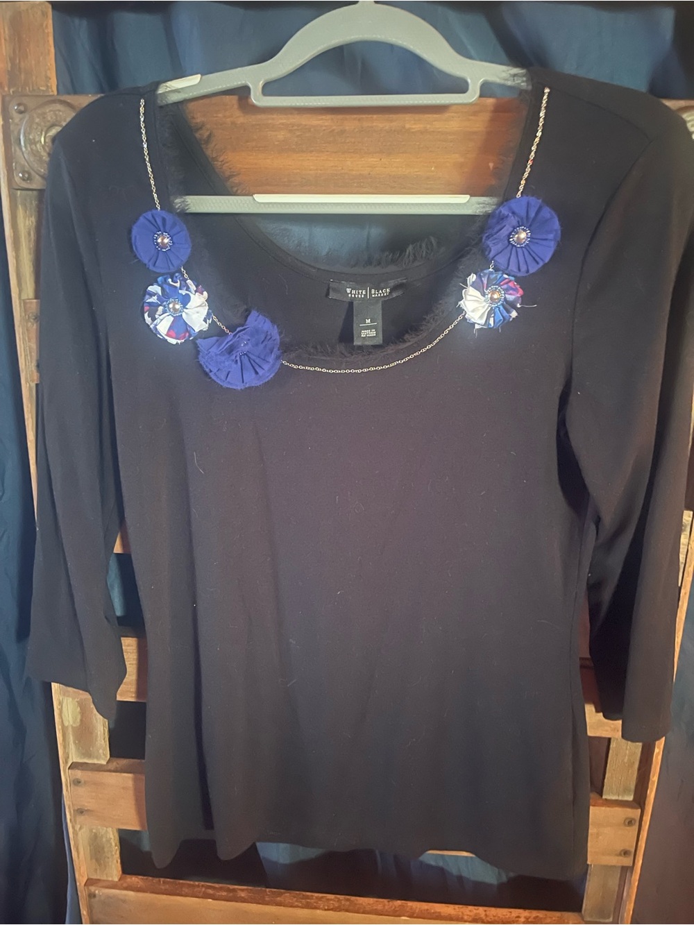 White House Black Market Black Top with Blue Floral Necklace Accent